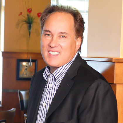 Photo of smiling restaurant founder Patrick.